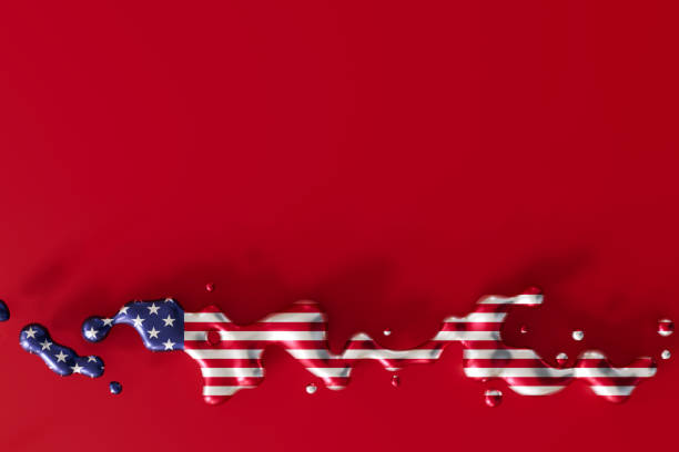 istock Stunning visual of American flag transformed into fluid, dynamic shape on deep red backdrop. Ideal for creative representations of US themes in ads, presentations, and editorial use. Copy space. 3D. 2166565108