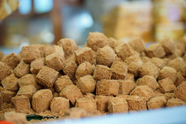 container holds a heap of brown, cube-shaped Tahu Sumedang, ready to be enjoyed.
