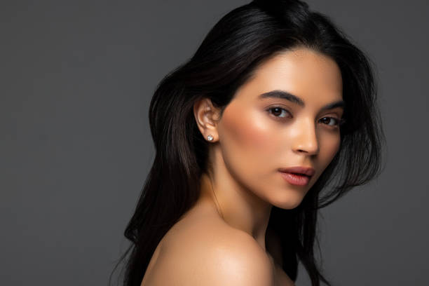 istock Beautiful woman face close up studio on dark background 2166565181
