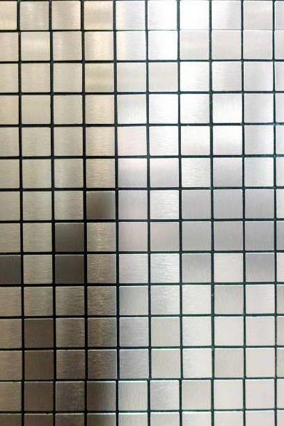 istock Metal background with reflective surface. The surface has a grid pattern of squares that adds a unique visual element to the design. 2166565275