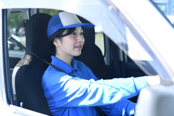 Asian female delivery driver driving