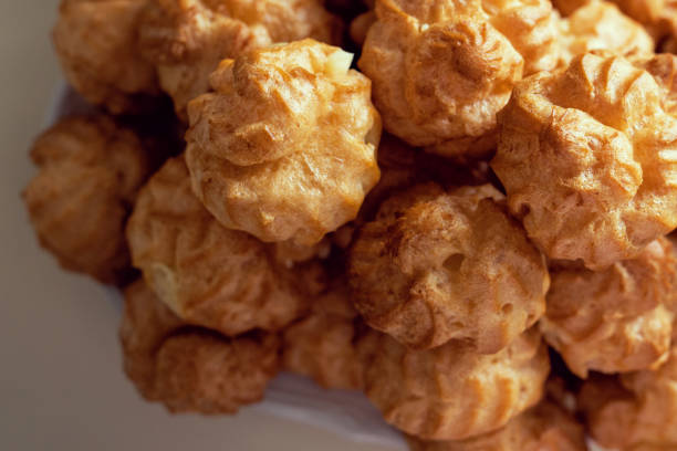istock Choux pastries with vanilla cream, top view 2166566088