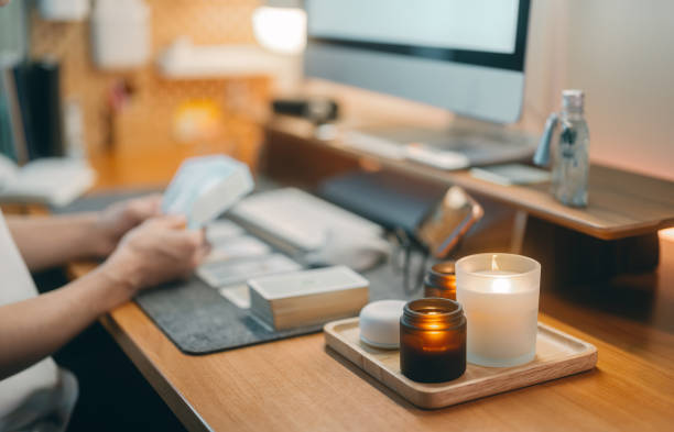 Focus on table with fragrance candle ritual ambient online fortune telling tarot card service Freelance working from home concept. Online fortune telling service. Focus on table with fragrance aroma candle for inspiration and ritual ambient. Blur background with tarot card. meditation room office stock pictures, royalty-free photos & images