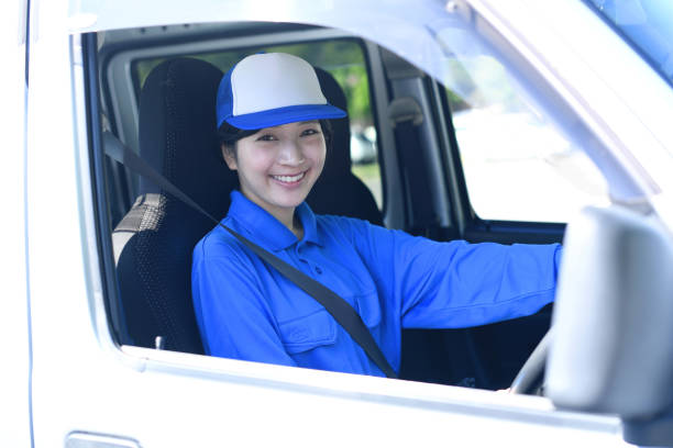 istock Asian female delivery driver driving 2166568763