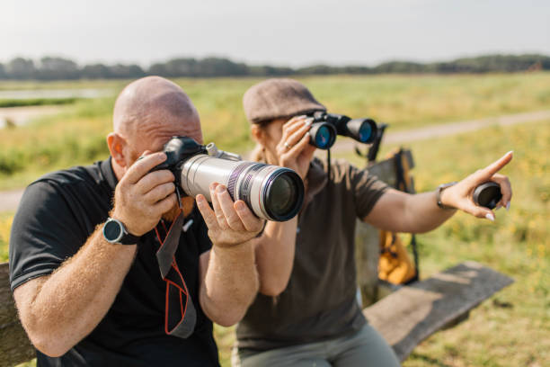 Senior birdwatching couple in the Netherlands