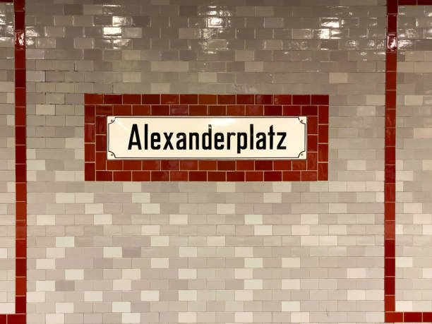 istock A white and red brick wall with a sign that says Alexanderplatz 2166569609