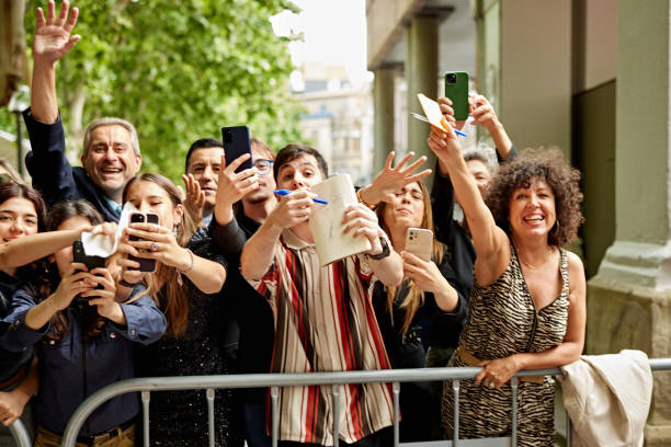 istock Enthusiastic fans hoping for celebrity attention 2166569819