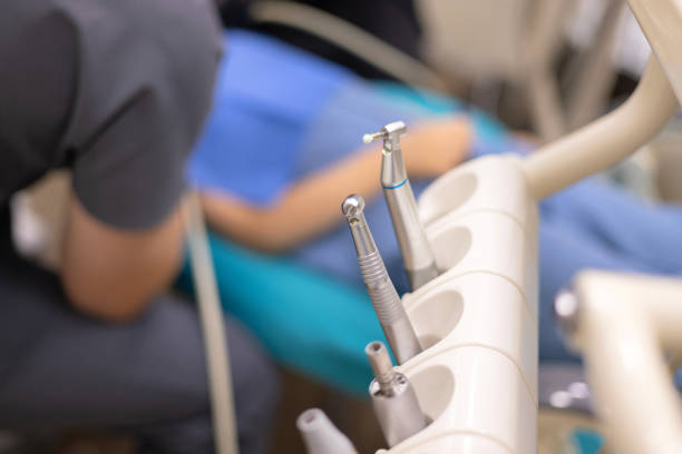 Professional stomatological equipment for doctor in dentist office. Cozy dental room in new modern stomatological clinic. Background of chair, accessories used by dentists in medic light. Copy space