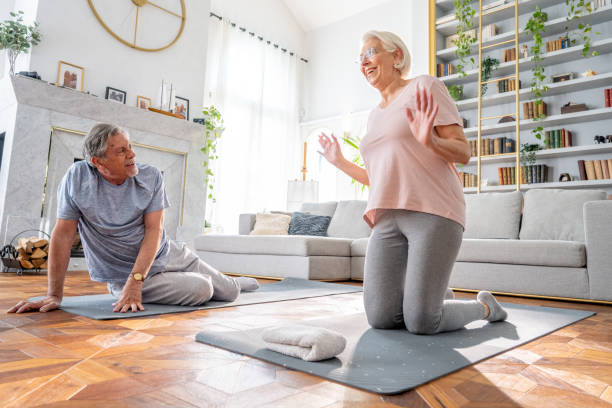 istock Active Senior Couple Exercising at Home 2166571675