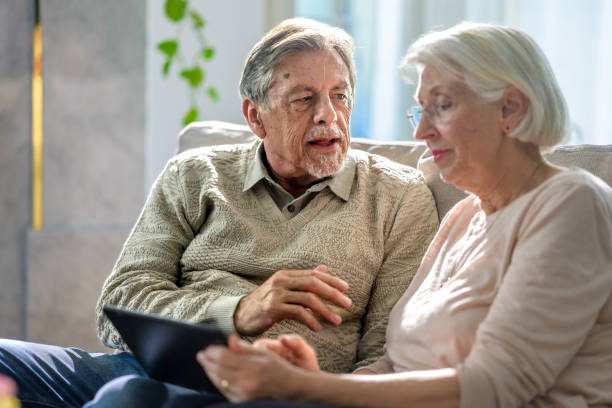 istock Senior Couple Engages with Technology 2166571708