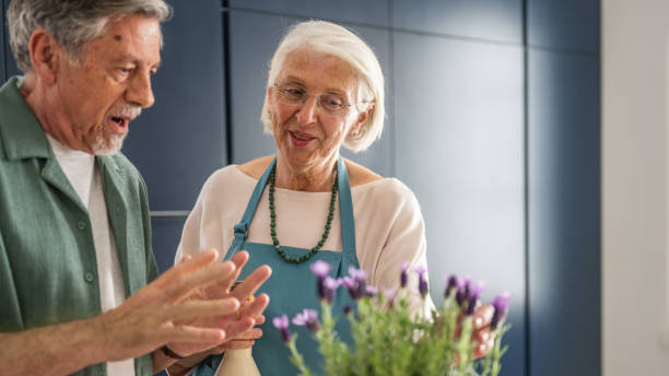istock Elderly Couple Engaged in Gardening Together 2166571725
