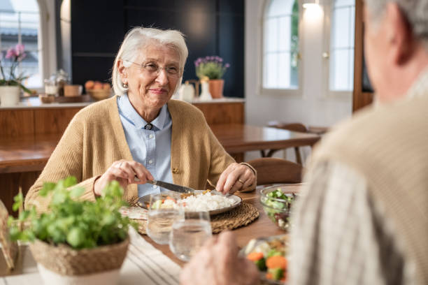 istock Senior Couple Dining at Home 2166571734