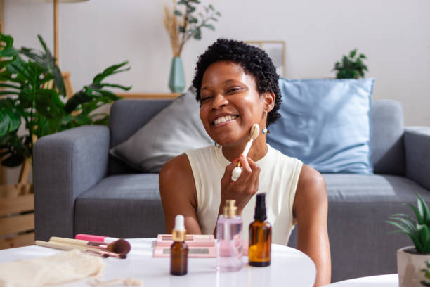 istock Happy young woman using jade roller during skincare routine at home 2166572128