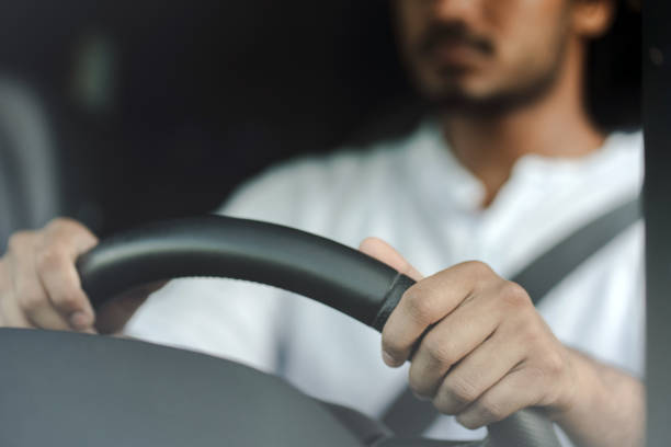 istock Businessman driving car holding steering wheel 2166572603