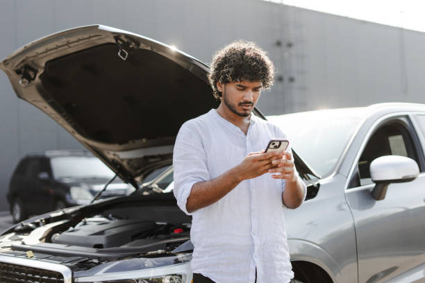 istock Indian man calling for assistance after a car breakdown in the city 2166572615