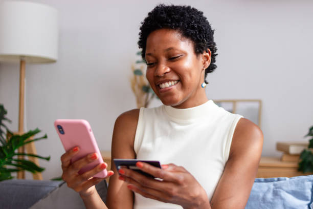 istock Happy customer making online payment using credit card and smartphone 2166573461