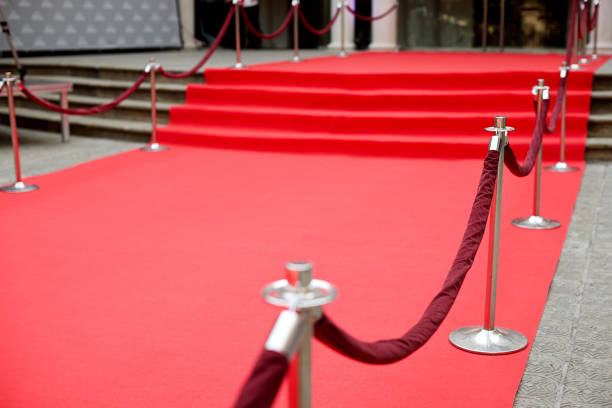 Rows and rows of Red theater seats.  Shallow depth of field. Vertical photograph.  Lots of room for copy.