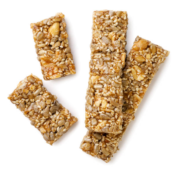Kozinaki bars and two halves close-up on a white background. Top view