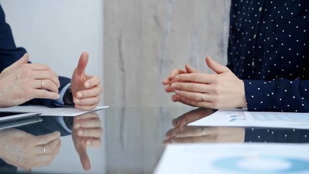 istock Professional handshake between two professionals and applauds at a corporate meeting with reflection on table over a business meeting. Business people concept 2166582154