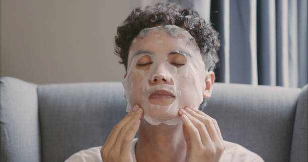 istock Man Relaxing with Sheet Mask at Home. 2166582301