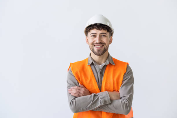 istock Young construction workers in hard hats and hamlet on a white background 2166584193