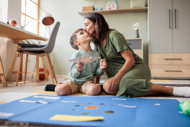 istock Mother and son making a solar system model at home 2166584565