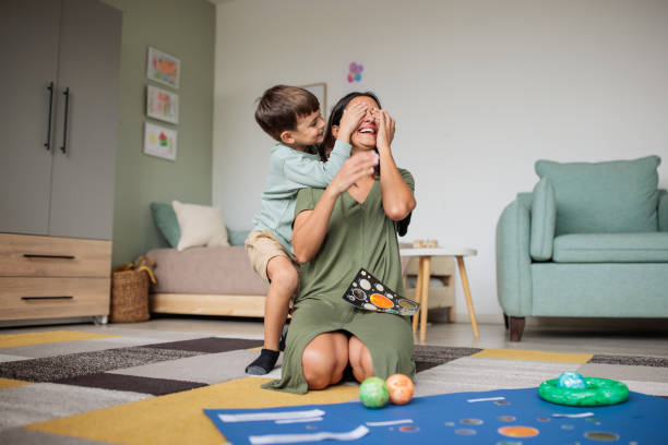 Mother and son playing at home