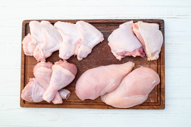 istock Raw mixed chicken meat parts  for cooking on rustic background 2166586232