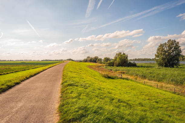 istock Dutch river dike in the summer season 2166586329