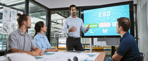 Engineer team brainstorm meeting in factory office. Presentation on ESG project planning (environmental, social, and corporate governance). Sustainable energy efficient. Industrial business concept