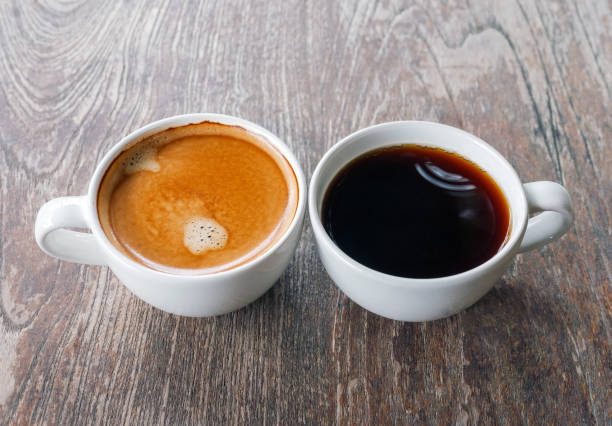 istock Two coffee cup, Americano coffee and espresso coffee on wooden table 2166588124
