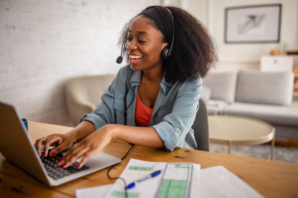 istock Black woman on video call wearing headset 2166590883