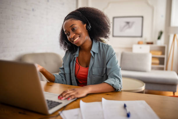 istock Individual using headset and laptop at home office desk 2166593609