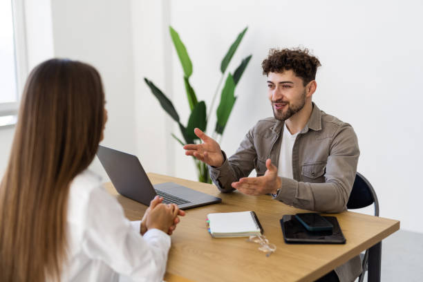 istock Young businesspeople working together in the office while using laptop 2166593727