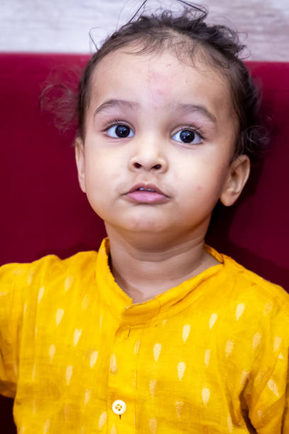 baby boy cute expression on religious occasion at indoor
