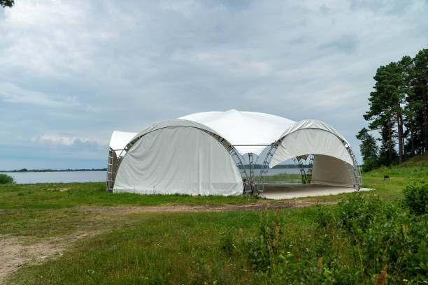 istock Canopy structure sits near a tranquil lake under cloudy skies 2166597037