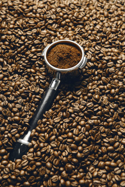 istock Espresso Preparation Process With Portafilter on Fresh Coffee Beans 2166601404