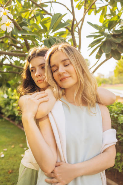 istock Mother and daughter hugging each other 2166601725