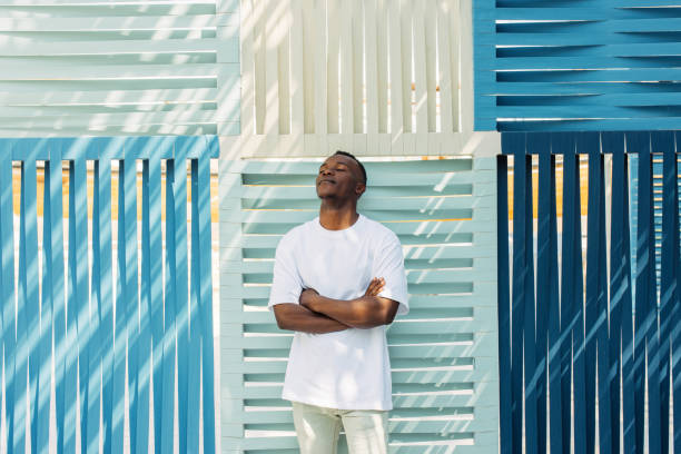 istock American guy enjoying a summer day outdoors 2166602973