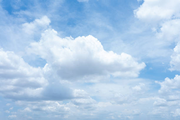 istock A bright blue sky with fluffy white clouds on a sunny day 2166603303