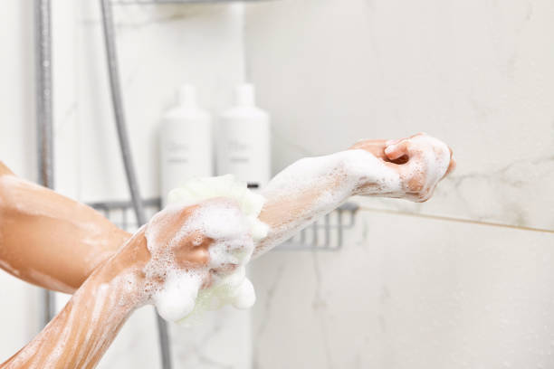 istock Woman washing her hands with foam bubbles and sponge 2166603338