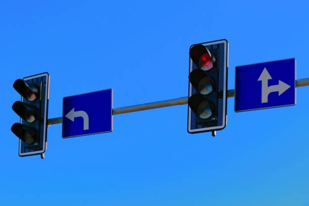istock Left and Right Direction Arrows with Traffic Lights - Intersection Guidance 2166603827