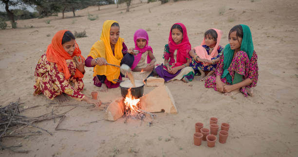 istock Indian children preparing chai - masala tea 2166604820