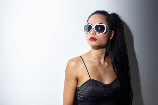 istock Cool young woman against white background 2166605330