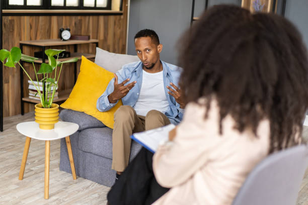 istock Man speaking to psychotherapist 2166605498