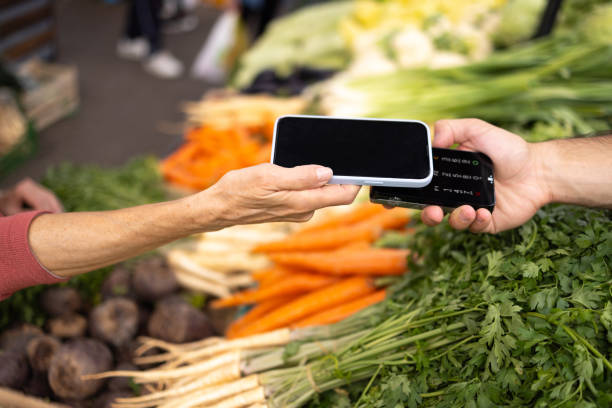 istock Mobile payment at a farmer's market 2166606766
