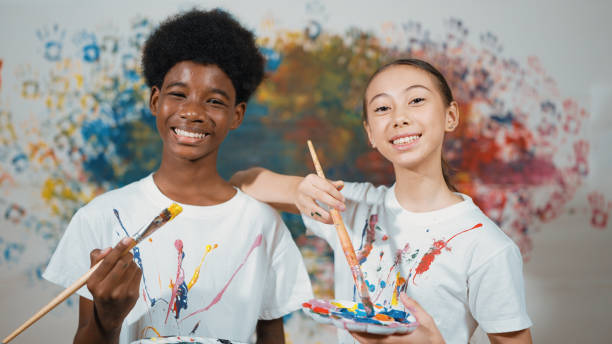 istock Student with mixed races smile and look at camera at art lesson. Edification. 2166608029