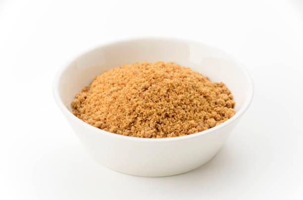 istock Powdered brown sugar in white bowl 2166608281