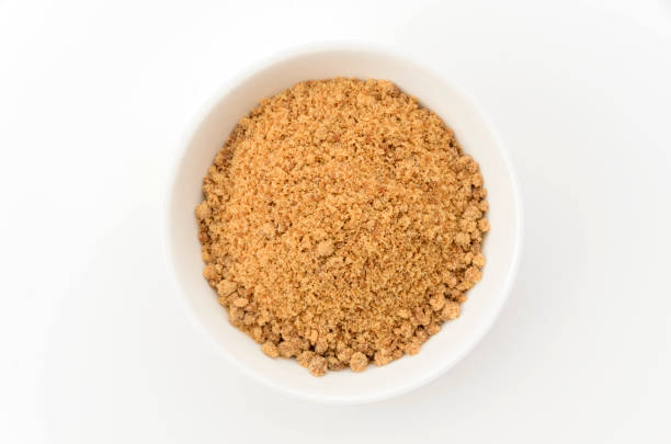 istock Powdered brown sugar in white bowl 2166608340