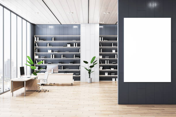 istock Modern office interior with blank vertical poster on the wall. 3D Rendering 2166610123